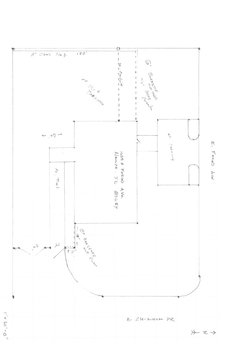 Site plan: 6.5-foot faux masonry fence approved around industrial gravel drive area